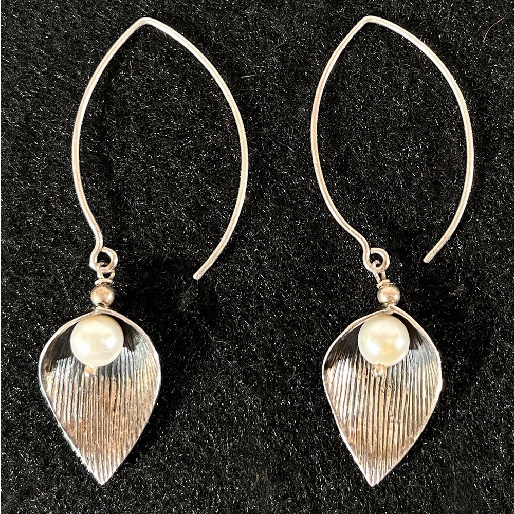Elegant leaf design earrings with pearl bought in India.